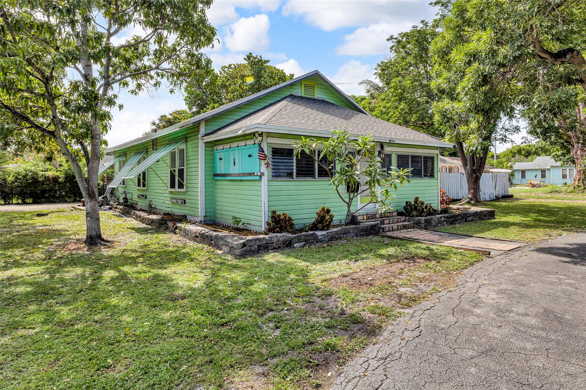 Charming & spacious 3-Bed / 2-Bath Florida Home in the heart of Pompano! Set on a rare 12,000 sq. ft. East facing corner lot & minutes to the beach & the newly developed Atlantic Pier/Briny Ave. promenade!! Walking distance to the Signature Golf course & huge Community Park, this prime location is also convenient to Malls, Dining, Shopping, and I-95! The inviting interior features a fabulous Chefs kitchen w/ commercial natural gas range, concrete & butcher block countertops, & bay window out to the lush backyard! The original hardwood floors & classic wood-burning fireplace highlight the timeless appeal! Outside, a newer roof, A/C storage shed, & fenced in yard also offers plenty of room to expand, construct a guest house, & easily add a pool! This is a truly rare find for a lucky buyer!