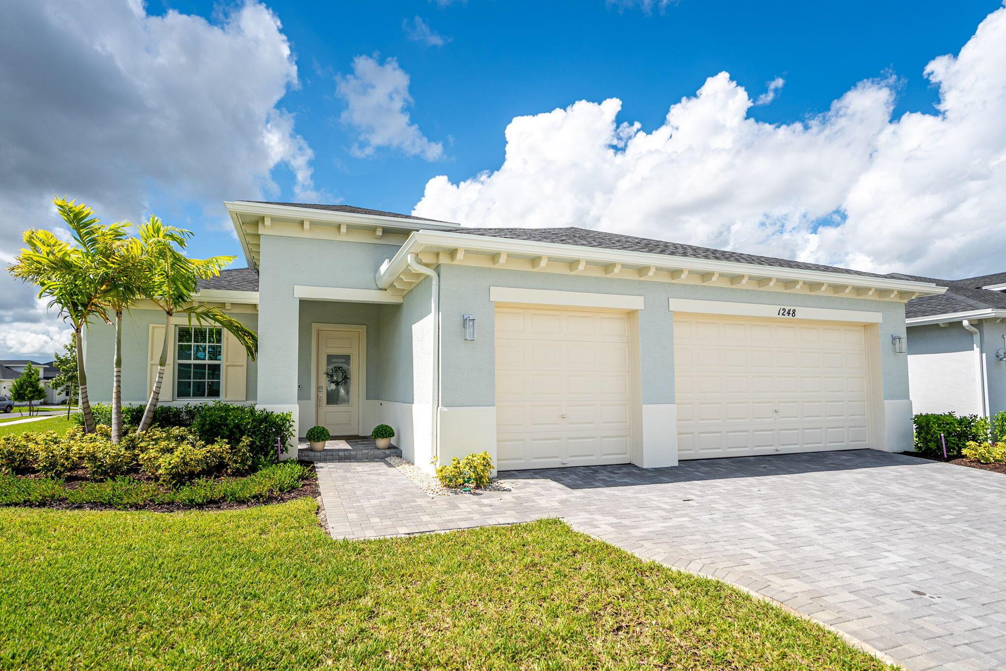 Welcome to this exceptional Paris Model, built in 2024 and set on a corner lot in the sought-after 55+ gated community of Veranda Preserve. Skip the wait of new construction and start enjoying the lifestyle you deserve right now.Designed with comfort and style in mind, this 3 Bedroom, 2 Bath, great room concept home is loaded with upgrades. The open interior showcases crown molding, tray ceilings, plantation shutters, and custom wood plank tile throughout. A chef's dream kitchen features a quatz island, white shaker cabinets, stainless appliances and a large pantry. You will love the large master bedroom featuring dual vanities, a walk-in shower, and a sizable walk-in wardrobe. Oversized 3 car garage and extended driveway offers additional storage and parking. The home features