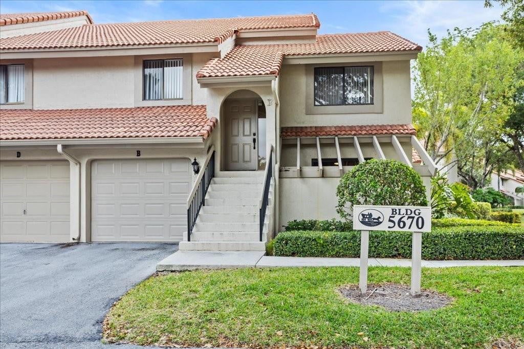 Photo of 5670 Coach House Circle #B, Boca Raton, FL 33486 (MLS # B26069526)