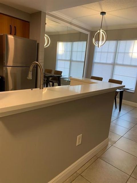 Tiny photo for 6020 W Sample Road #105, Coral Springs, FL 33063 (MLS # B26040580)