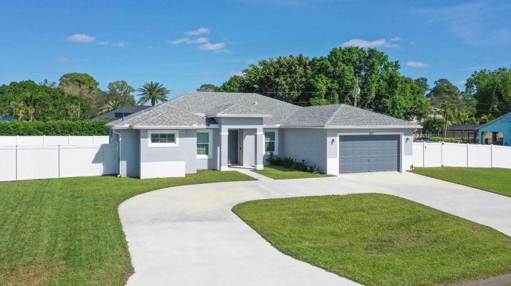 Photo of 2017 SW Justison Avenue, Port Saint Lucie, FL 34953 (MLS # R11063434)