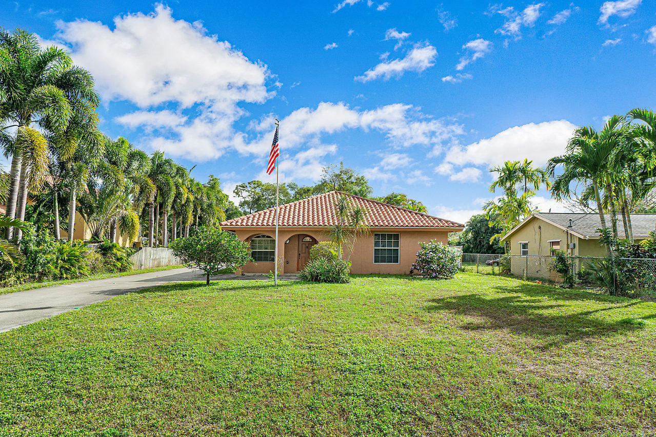 NO HOA and A+ Schools!!! 3 bedrooms 2 bathrooms 2 car garage single family home in the rarely available Palm Beach Farms neighborhood. Tile throughout the entire home. Nicely updated kitchen and bathrooms, spacious bedrooms, impact windows, large laundry room with full size washer and dryer. Master suite has a large walk in closet and en-suite bathroom with a walk in shower and a separate tub! Detached garage is not a part of the rental. Small pets approved on a case by case basis. No evictions. Must make 2.5 times the rent.