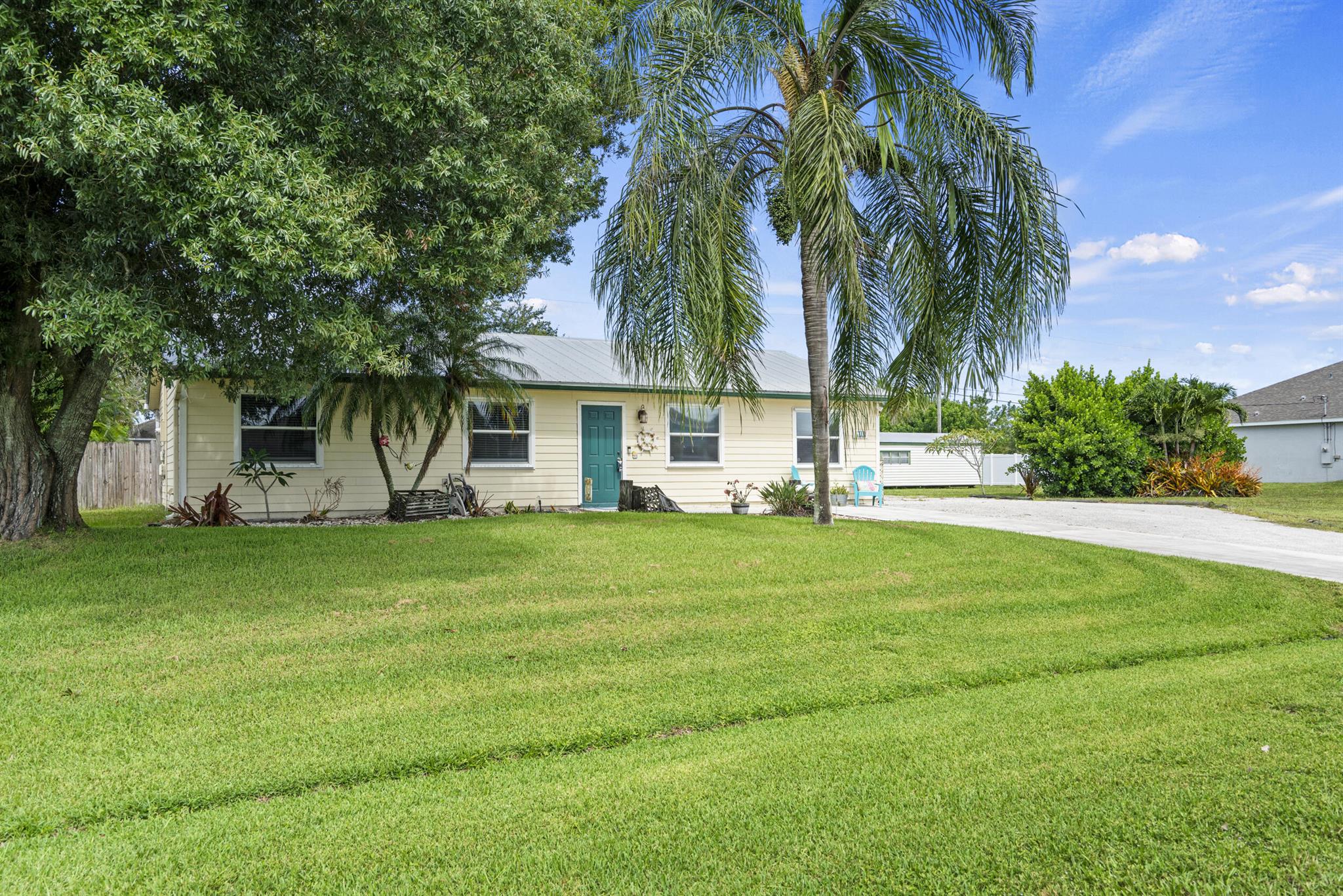 Cute and clean 3 bedroom, 2 bath 1400 sq ft home is great location just off Becker Road in Port St Lucie. Ready for your personal touches! Home has been updated with Hardie Plank Siding and a metal roof. This home has a buried 120 gal propane tank which fuels the Range in the kitchen and the Tankless Water Heater. Great access to Turnpike and I-95. Publix just across the bridge. Located on a quiet side street - no through traffic. Fenced back yard with storage shed. Space for RV or Boat on side of house. Oversized driveway