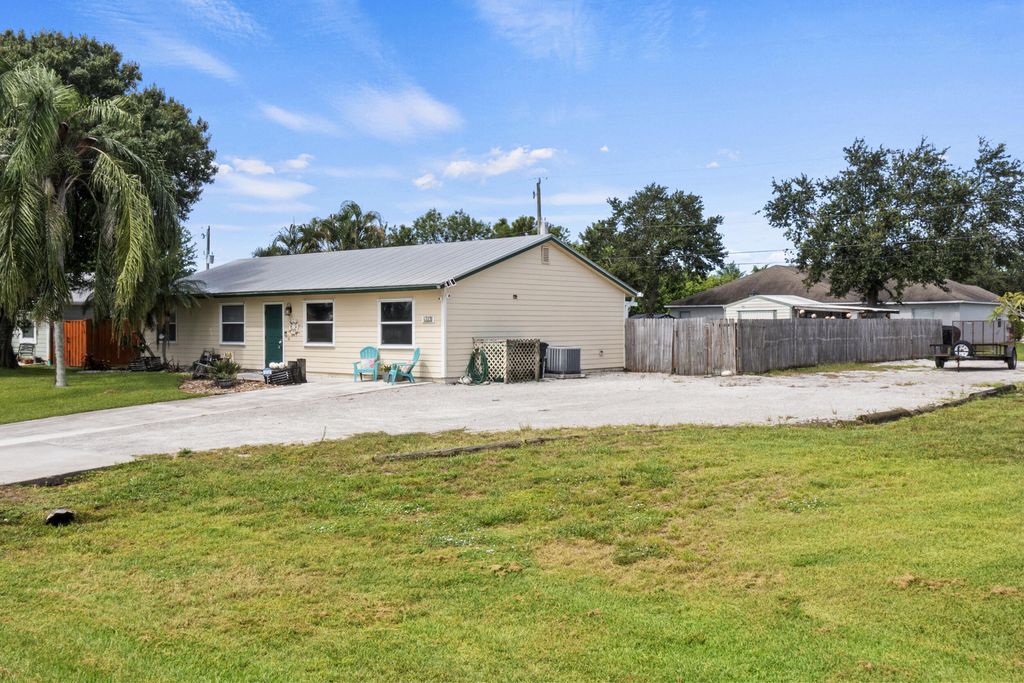 Photo of 416 SW Bradshaw Circle, Port Saint Lucie, FL 34953 (MLS # R11109750)