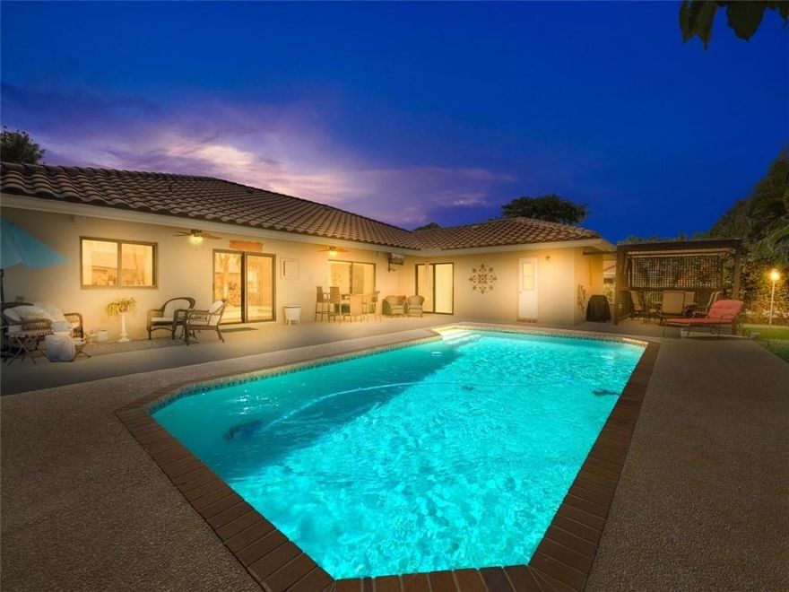 Large palm trees nestled in a lush colorful landscape & a charming courtyard style patio are the hallmarks of this wonderful home. Warm & welcoming, this spacious 4 bedroom on a cul-de-sac will be your blissful retreat from the busy work week. Upon entry, you will be swept away by the elegance of the vaulted ceiling, and drawn in by the natural light through impact windows. The gourmet kitchen features granite counters, updated solid wood slow close cabinets, & stainless steel Samsung appliances. Perfect for entertaining, the formal dining area longs for large family gatherings and huge pool with accommodating patio is perfect for parties and special occasions. The super low HOA $225.00 per year & location near upscale restaurants, shopping & more, makes this the ideal home for everyone.