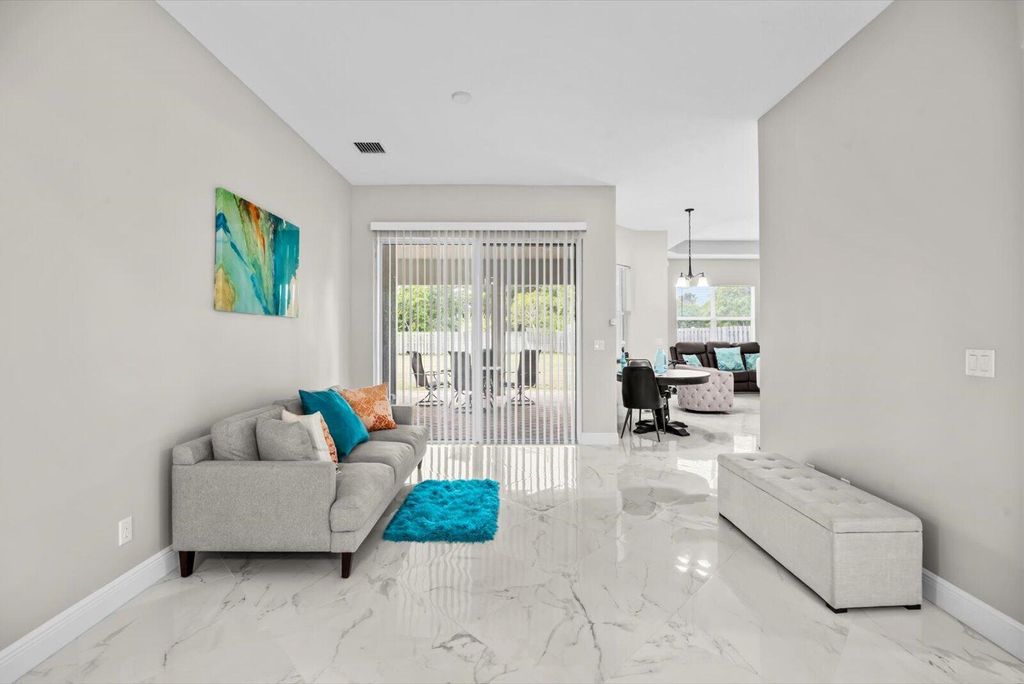 Photo of 562 SW Souris Avenue, Port Saint Lucie, FL 34953 (MLS # R11159804)