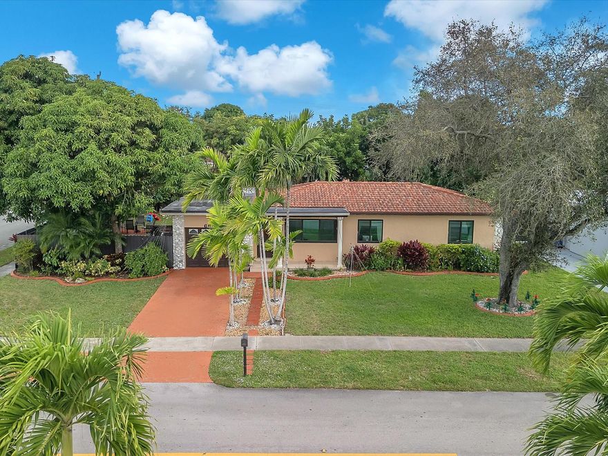 Beautiful corner home on the largest lot in the neighborhood, located in a quiet community with no HOA. Single-story layout featuring 3 bedrooms, 2 baths, comfortable living areas, and a remodeled kitchen. The screened porch opens to a spacious backyard with fruit trees, offering privacy and flexibility. Impact windows throughout, a 7-year-old roof, and a 5-year-old A/C provide peace of mind. Includes a one-car garage, additional storage, and ample parking. Conveniently located just 2 minutes from the Turnpike. Seller motivated—an excellent opportunity for first-time buyers or investors seeking passive rental income.