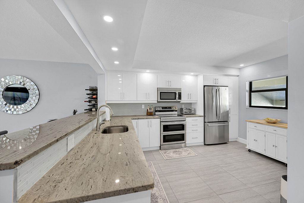 Photo of 12870 Briarlake Drive #201, Palm Beach Gardens, FL 33418 (MLS # R11156712)