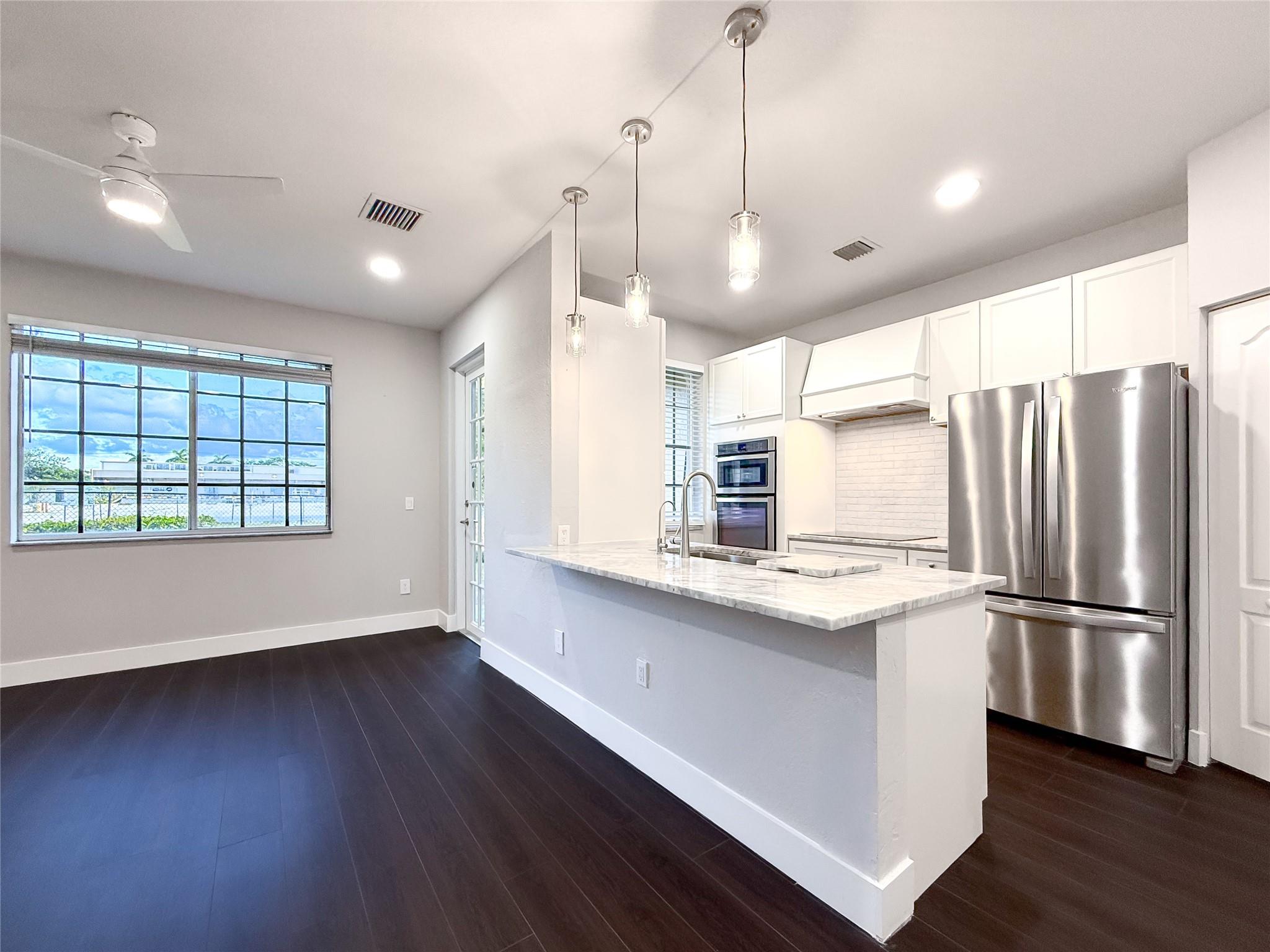Step into your dream home! This COMPLETELY RENOVATED 3 bedroom, 3 full bath townhouse in Riviera Beach has everything you’ve been looking for! The MODERN kitchen shines with CUSTOM cabinets, STAINLESS STEEL appliances, GLASS cooktop, and BUILT-IN oven & microwave! Every bathroom has been COMPLETELY UPDATED, and the master suite boasts a WALK-IN closet. Enjoy the convenience of an IN-UNIT washer & dryer plus a NEW water heater and AC handler (2025). Just 10 MINUTES from the beach, you’ll also enjoy RESORT-STYLE living with a pool, fitness center, sports courts, playground, clubhouse, and 24/7 security. Whether you’re searching for your forever home or a smart investment opportunity, this is the one—RENTALS ALLOWED!