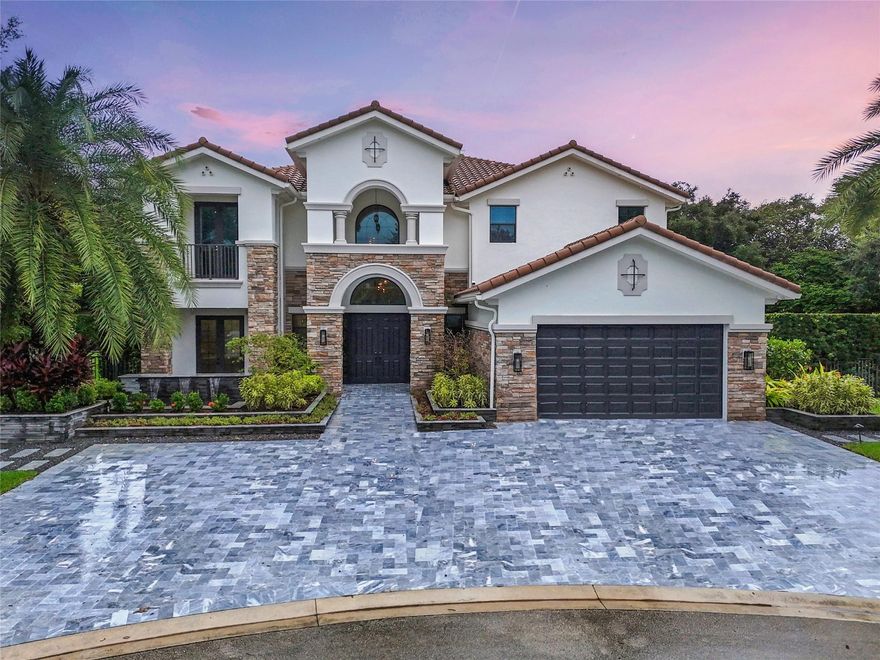 ABSOLUTELY STUNNING!!! This home boasts the finest finishes in Parkland under $3 million. Set on a spacious half-acre pie-shaped lot, it features a top-of-the-line kitchen worth $250,000 and sprawling 24’ ceilings. The downstairs includes a true mother-in-law suite complete with its own kitchen and family room. The backyard is surrounded by 10’ podocarpus hedges and beautifully landscaped beds. The freeform pool has an oversized sun shelf for relaxation. Interior upgrades include a fully integrated low-voltage security system with wireless access points, a Sonos sound system, invisible speakers with three touchpoint access tablets, a three-zone HVAC system, and wireless controls for the fireplace and motorized shades. PGCC is the epitome of luxury living.