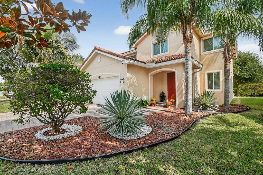 Photo of 830 Palm Tree Lane, Haverhill, FL 33415 (MLS # R11144700)