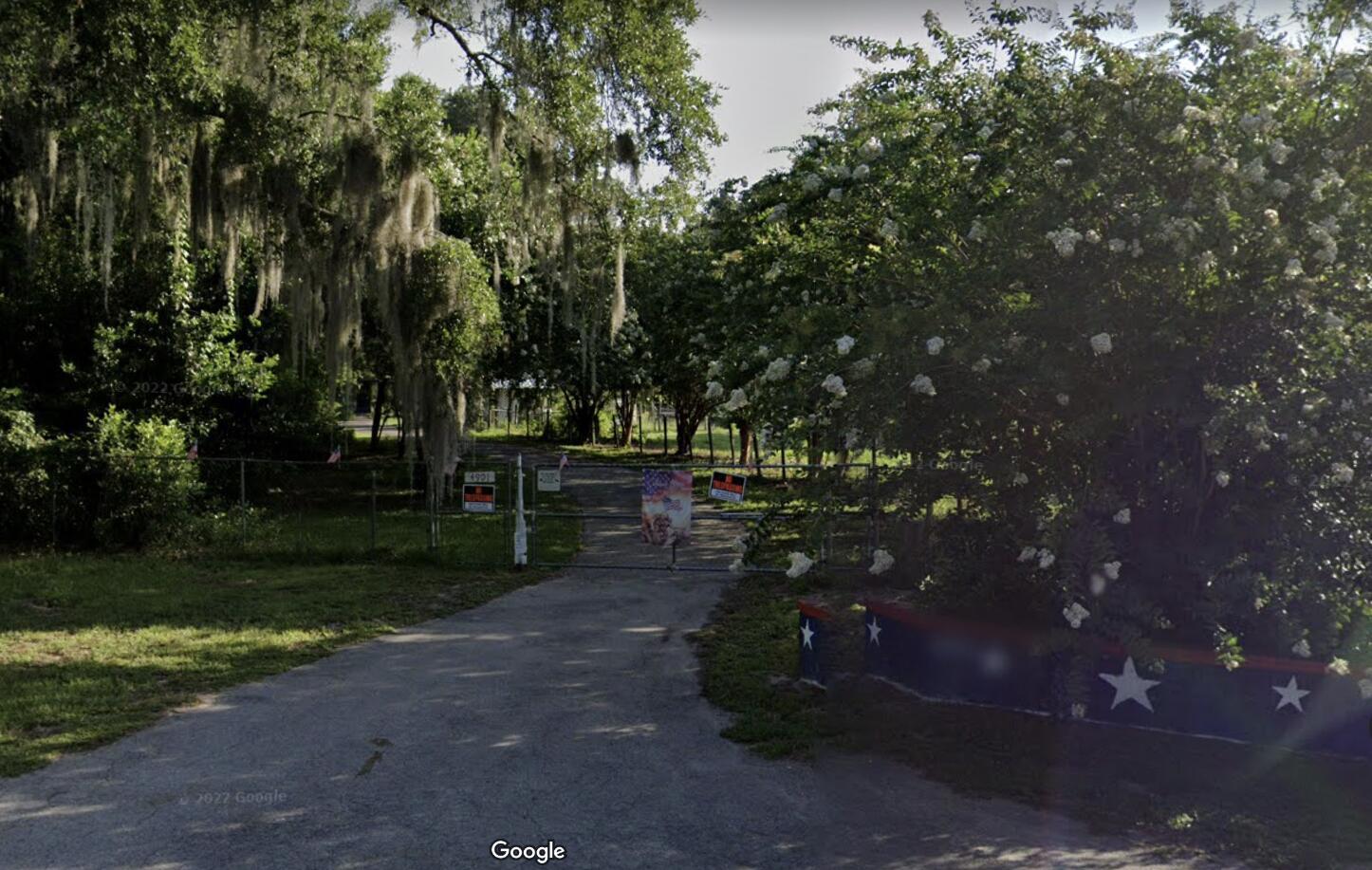 Over 4 acres, Beautiful Oak Hammock, property ready for your new home. In place, swimming pool, and generator with thousand gallon in ground tank, well and septic, and concrete slab three car garage workshop, and Pole-Barn, fenced and cross fenced, asphalt paved driveway.Near The Village's Shopping & Restaurants;A Great Place to Be.