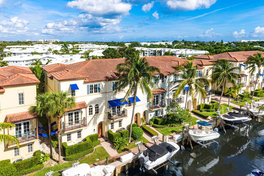 Inside the exclusive, gated, waterfront community of Estancia is this spacious, southern facing, 3-story end unit townhome on the Intracoastal Canal. The well designed floor-plan features 3 bedrooms & 3.5 baths, offering plenty of space for leisurely living as well as entertaining. The 1st floor features a private guest bedroom, with a full bath, perfect as an office or for visiting guests. The main living area is situated on the 2nd floor, consisting of the living room, dining room, kitchen & powder room. The updated kitchen is large and adorns a wine fridge, Bosch refrigerator & walk in pantry. The 3rd floor houses the primary suite and a 2nd guest bedroom. The Primary Suite has a huge closet and dual sinks, as well as a separate tub and shower. This home has generous ceiling