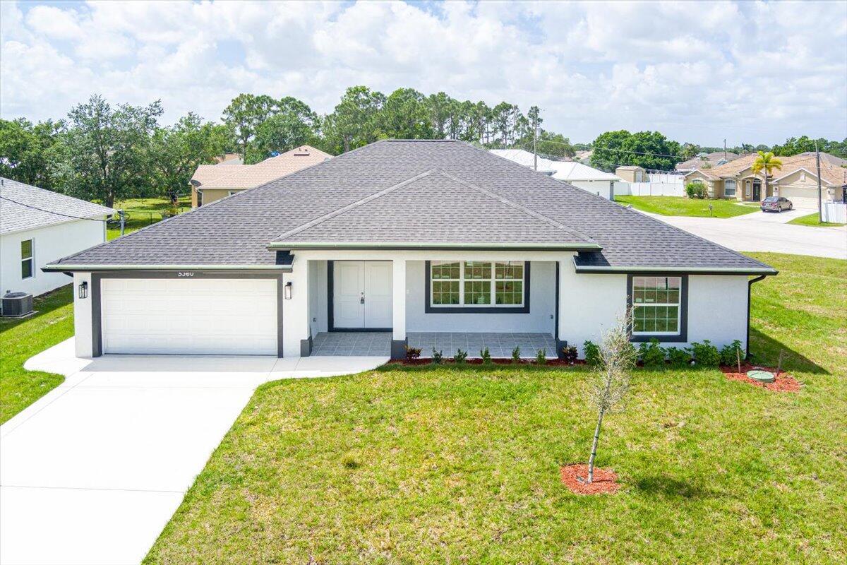 New construction house in desirable Torino area of Port St Lucie. House boasts 4 bedrooms and 3.5 bathrooms. It has an outdoor shower and tons of room for a pool. It sits on a corner lot in a cut-de-sac and is a little smaller than 1/3 acre so there is plenty of room. Interior of the house has tons of upgrades. Ten foot ceilings in common area, open, modern floor plan, impact windows, waterfall style kitchen island, granite backsplash, upgraded granite in kitchen, bathrooms and window sills, porcelain tile throughout the house, bathroom tiled floor to ceiling. Soft close kitchen cabinets, seamless glass shower enclosures, modern lighting fixtures and LG kitchen appliance package. over $60,000 in upgrades already included in the house.