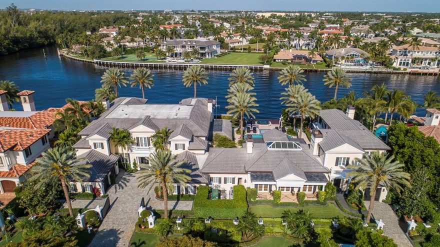 Gated and walled Palm Beach-inspired Georgian Intracoastal Estate sited on 2 lots with 200 ± feet of waterfrontage overlooking an      expansive view of the ICWW.

Lavish entertaining is set in the center Party Pavilion (Great Room 37 x 26) with professional bar, soaring fireplace and large window wall of sliders that open to the pool/patio.

Resort-style pool/patio with spa,fountain, boat lift and expansive landscaped grounds for entertaining.  Shown By Appointment Only. DISCLAIMER: The written and verbal information provided including but not limited to prices, measurements, square footages, lot sizes, calculations and statistics have been obtained and conveyed from third parties such as the applicable Multiple Listing Service, public records as well as other sources. All information including that produced by the Sellers or Listing Company are subject to errors, omissions or changes without notice and should be independently verified by any prospect for the purchase of a Property.  The Sellers and Listing Company expressly disclaim any warranty or representation regarding all information.  Prospective purchasers' use of this or any written and verbal information is acknowledgement of this disclaimer and that Prospects shall perform their own due diligence.  Prospective purchasers shall not rely on any written or verbal information provided when entering a contract for sale and purchase.  Some affiliations may not be applicable to certain geographic areas. If your property is currently listed with another agent, please do not consider this a solicitation for the listing. In the event a Buyer defaults, no commission will be paid to either Broker on the Deposits retained by the Seller.  "No Commissions Paid until Title Passes."  Copyright 2019 Listing Company. All Rights Reserved.