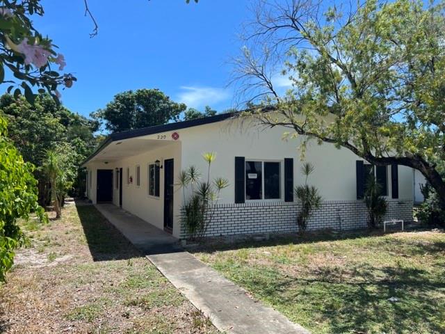 This (2) two bedroom, 1 bathroom apartment is 1 mile from the beach (20 min walk) and within walking distance to grocery store, restaurants, and bars. Beautiful kitchen with Quartz countertops and stainless steel appliances. Bathroom has a tub shower, new toilet and vanity with storage. The unit has central A/C, impact windows, new roof, 2 parking spots in front of unit and guest parking is available. This unit is one of 3 with access to a laundry (washer and dryer). Water is included in rent. Easy to see and quick approval.