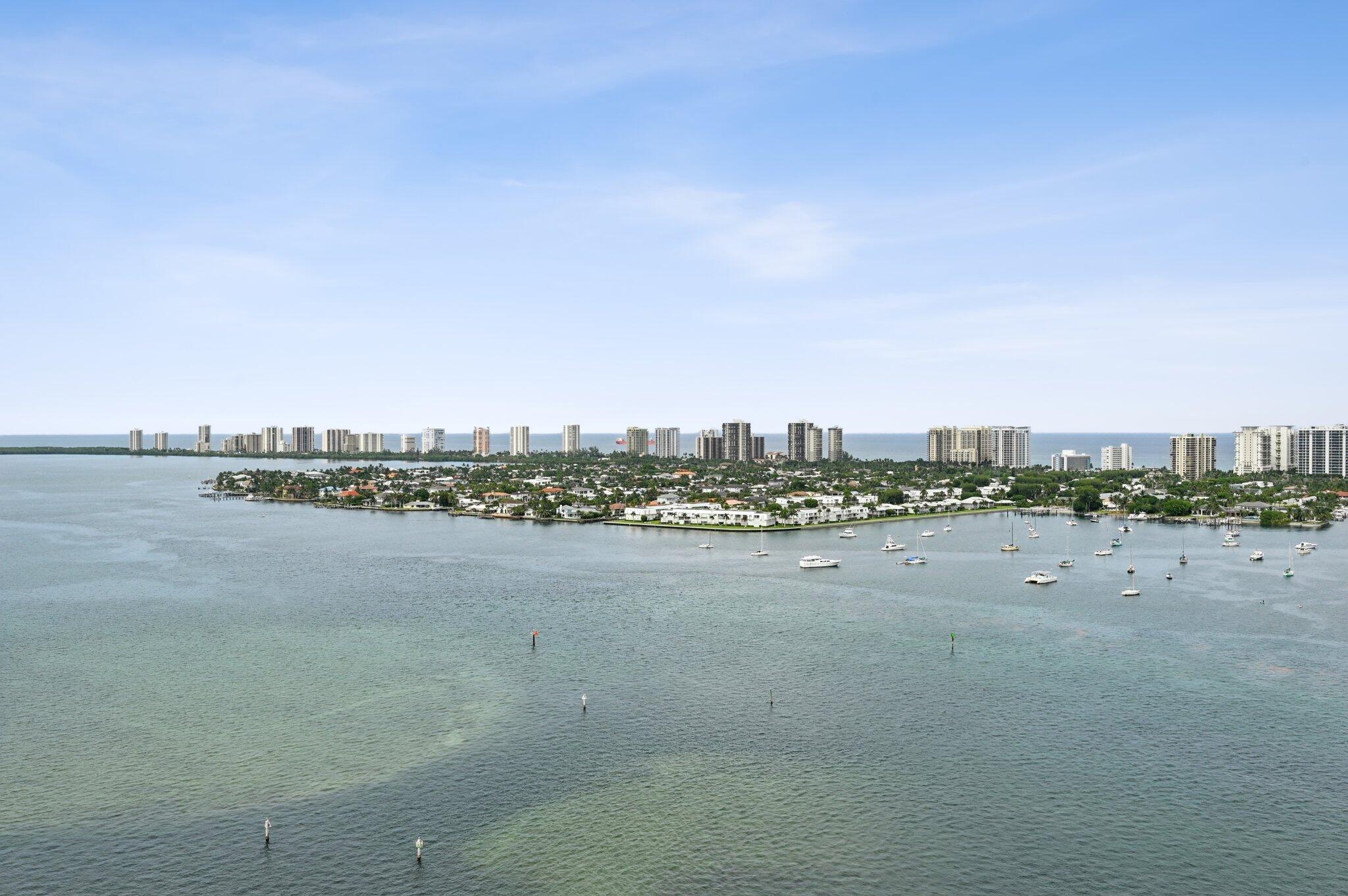 Gorgeous direct, unobstructed views of the Intracoastal Waterway and Atlantic Ocean from this preferred Ocean Tower, 23rd-floor residence at Marina Grande. Enjoy breathtaking sunrises and refreshing ocean breezes from your spacious balcony, living room, and owner's suite. Desirable split floor plan features 2 bedrooms plus a large den--ideal for a home office or 3rd bedroom. The chef's dream kitchen boasts seating for six at the countertop bar, new custom cabinetry, white quartz countertops, a turquoise glass backsplash, and premium Kenmore & KitchenAid stainless steel appliances, including induction cooktop, warming drawer, and convection oven. The owner's suite is a relaxing retreat with dual white custom vanities, a walk-in shower with frameless glass doors, a separate water closet, and
