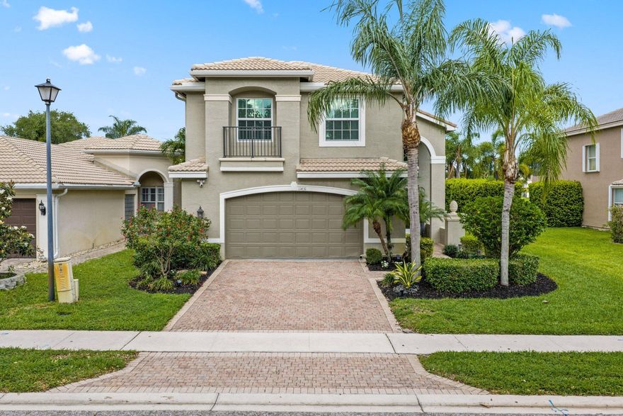 Welcome to the highly sought-after Jasmine model in Canyon Isles of Boynton Beach—where upgrades, functionality, and resort-style living come together. This two-story home offers 4 bedrooms, 2.5 bathrooms, and 2,746 sq ft of well-designed space. Impact windows and doors provide safety and efficiency, while upgraded lighting adds a bright, modern touch throughout.  The renovated laundry room features white cabinetry, quartz counters, and a deep stainless-steel sink. The kitchen includes a custom pantry with built-ins and a frosted glass door.  Step outside to a private backyard oasis with a custom pool and spa (2018), complete with a sun shelf, LED lighting, spa spillway, and screened enclosure overlooking the lake.  Additional upgrades include a renovated half bath (2021), exterior paint (2020), newer LG appliances (2023-2024), a 2025 water heater, and updated pool equipment.  Canyon Isles has approved a full clubhouse renovation, including a resort-style pool, cabanas, pickleball courts, expanded fitness center, and updated social and family spaces—enhancing both lifestyle and long-term value.