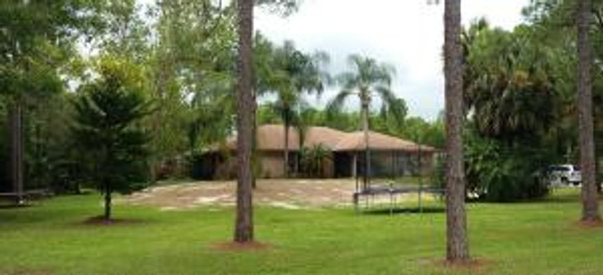 All sizes,dimension,figures are estimated. Handy man special! Located on one of the best streets in Jupiter Farms. 3 Bedroom  Monde Country Executive model in need of some help. Attached 2 car garage and detached 2 car garage and workshop. Screened patio and pool.