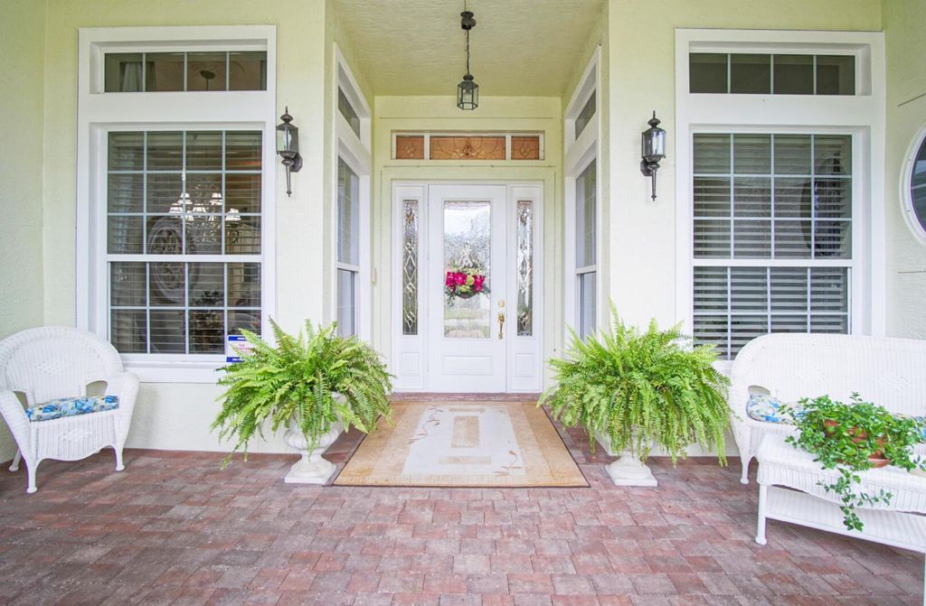 Photo of 171 NW Magnolia Lakes Boulevard, Port Saint Lucie, FL 34986 (MLS # R11022794)