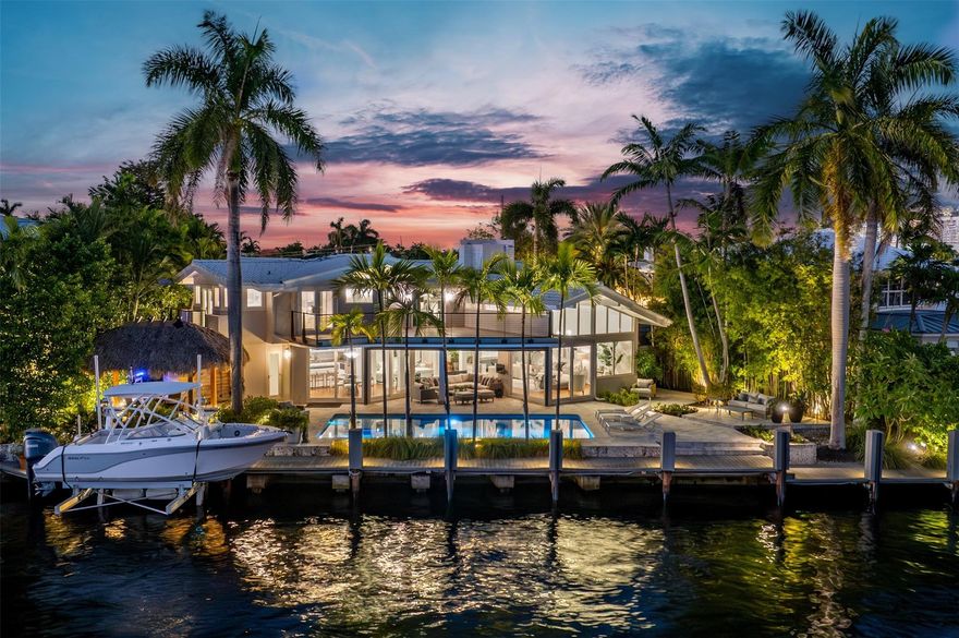 Showcasing 115 feet of prime waterfront on an extra-wide canal just 43 feet from the Intracoastal, in a year round slow speed (minimum wake) zone, this Coral Ridge residence captures full southern exposure and sweeping water views. The home’s architecture is strategically positioned on an angle with walls of glass to maximize the vistas from every room. A rare mid-century modern design, updated with impact glass, designer lighting and modern appliances. Vaulted ceilings enhance the open flow to the saltwater pool and summer kitchen an exceptional blend of light, water, and timeless architecture.