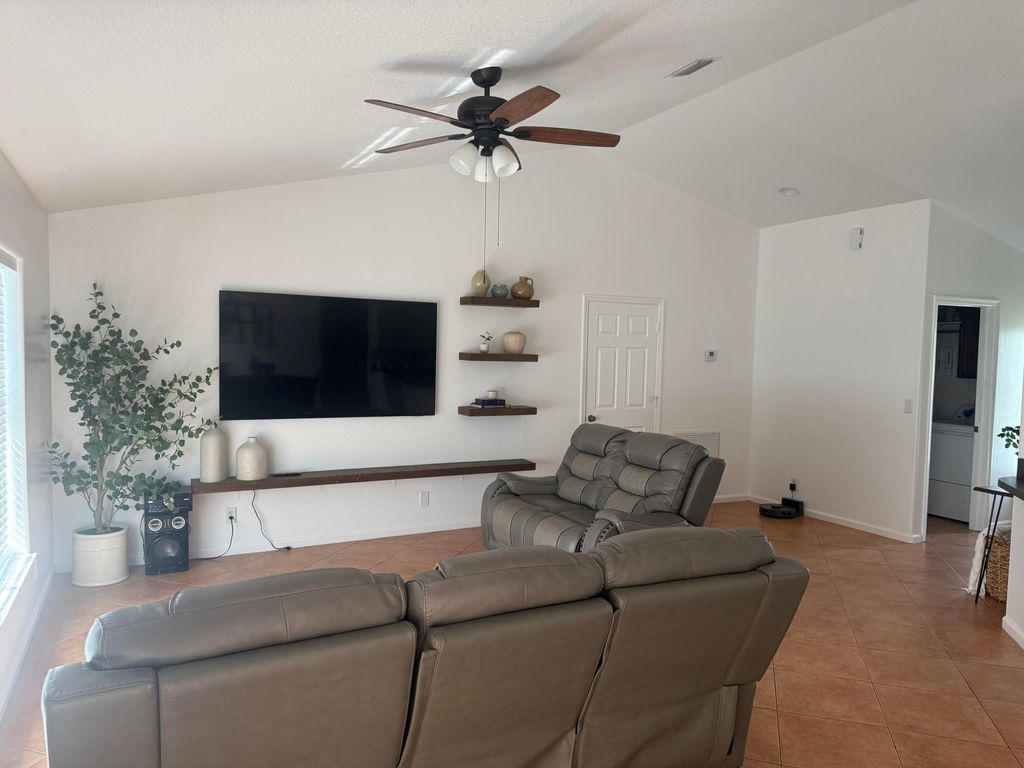 Photo of 1965 SW Hillman Street, Port Saint Lucie, FL 34953 (MLS # B26020969)