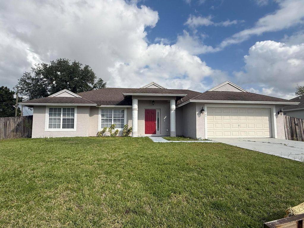 Photo of 1965 SW Hillman Street, Port Saint Lucie, FL 34953 (MLS # B26020969)
