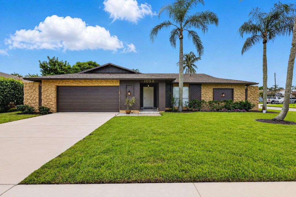 Photo of 1058 Fernlea Drive, West Palm Beach, FL 33417 (MLS # B26073375)