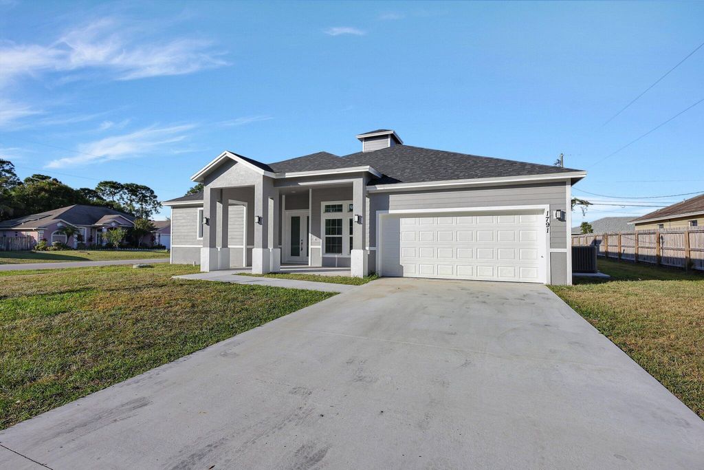 Photo of 1791 SW Effland Avenue, Port Saint Lucie, FL 34953 (MLS # R11043247)