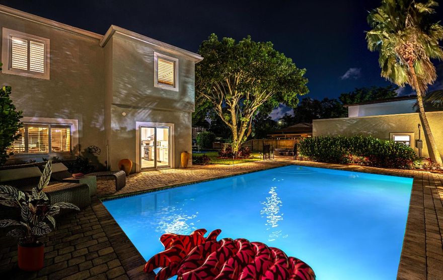 Exceptional 8-bedroom, 5-bath compound on a rare double lot featuring a resort-style pool and private pickleball court. Extensively renovated with a 2022 roof, hurricane impact windows, updated electrical and plumbing, spa, pool heater, new flooring throughout, and fully renovated kitchens and bathrooms.
 The property offers 3,048 square feet of interior living space with an additional 800 square feet of covered space, including a two-car garage. Three separate living spaces include a 5-bedroom main residence with a new gourmet kitchen and quartz waterfall countertops, an upstairs 1-bedroom/1-bath apartment, and a brand-new 2-bedroom/1-bath pool house. Spacious, light-filled rooms and central air in each building provide modern comfort, with multiple washer and dryer setups. Currently a top-producing short-term rental with stellar reviews, generating nearly $275,000 in its first year of operation. Impeccably located within five minutes of downtown West Palm Beach, this versatile compound is ideal as a private family estate, income-producing investment, or both. Offered fully furnished and completely turnkey- future bookings transferrable!