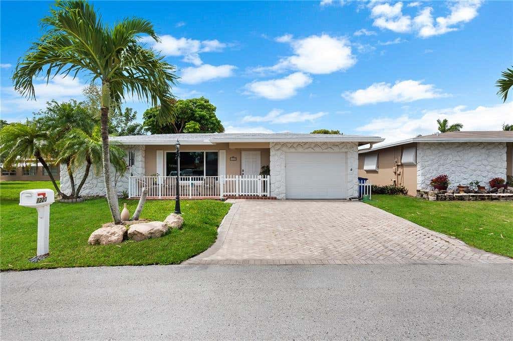 Photo of 1220 NW 45th Ct, Deerfield Beach, FL 33064 (MLS # F10290386)