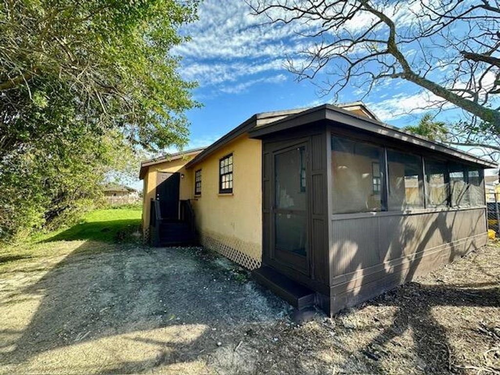 Photo of 125 SW Sw 11th Avenue, South Bay, FL 33493 (MLS # R10967468)