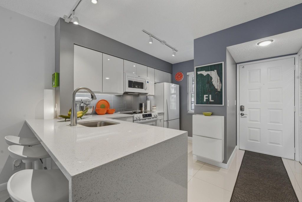 Photo of 2226 N Cypress Bend Drive #102, Pompano Beach, FL 33069 (MLS # F10550291)