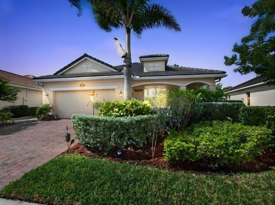 An entertainer's DREAM awaits in Victoria Parc at Tradition! Step into your own private backyard oasis, featuring a spacious tiki hut with ample seating, a fully equipped outdoor summer kitchen (grill, sink, refrigerator, and ice machine), a custom 6-person ThermaSpa, and over $7,500 in upgraded electrical for TVs, lighting, and more. The fully fenced, pie-shaped lot offers generous side yards--perfect for play, pets, or gardening--and includes a complete French drain system, allowing you to truly enjoy the outdoor space year-round. This exceptional home showcases over $85,000 in owner upgrades, making it completely move-in ready from day one. Designed for seamless indoor/outdoor living, the home features extended pavers, with both the front porch and rear patio fully screened.