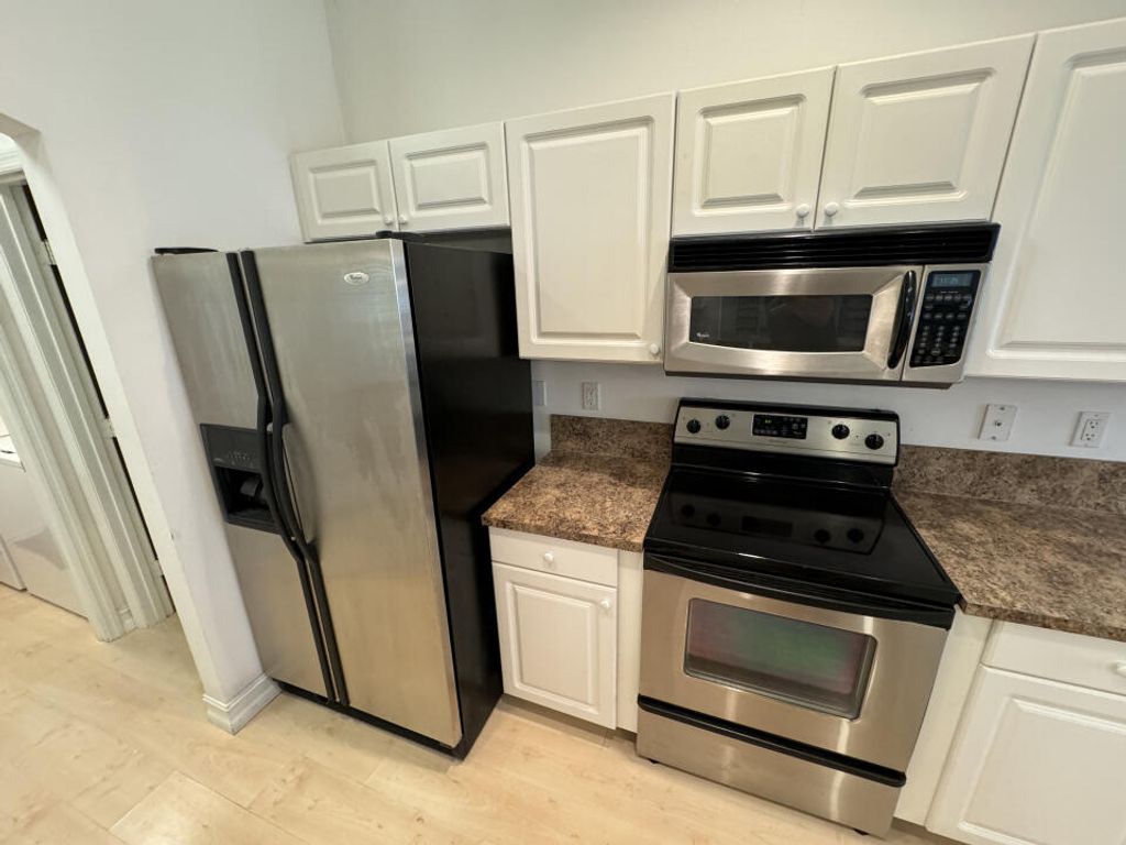 Photo of 1462 SW Apache Avenue, Port Saint Lucie, FL 34953 (MLS # R10935617)