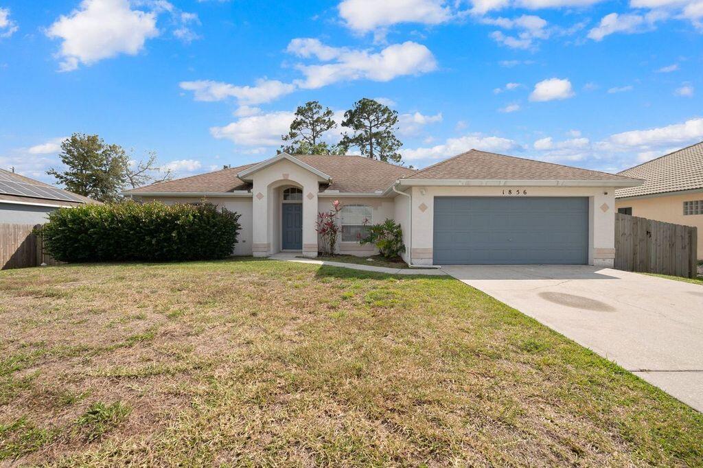 Photo of 1856 SW Altman Avenue, Port Saint Lucie, FL 34953 (MLS # R10782921)