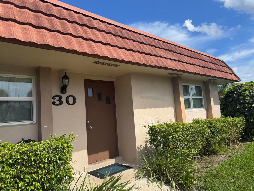 Photo of 5725 Fernley Drive E #30, West Palm Beach, FL 33415 (MLS # B26072749)