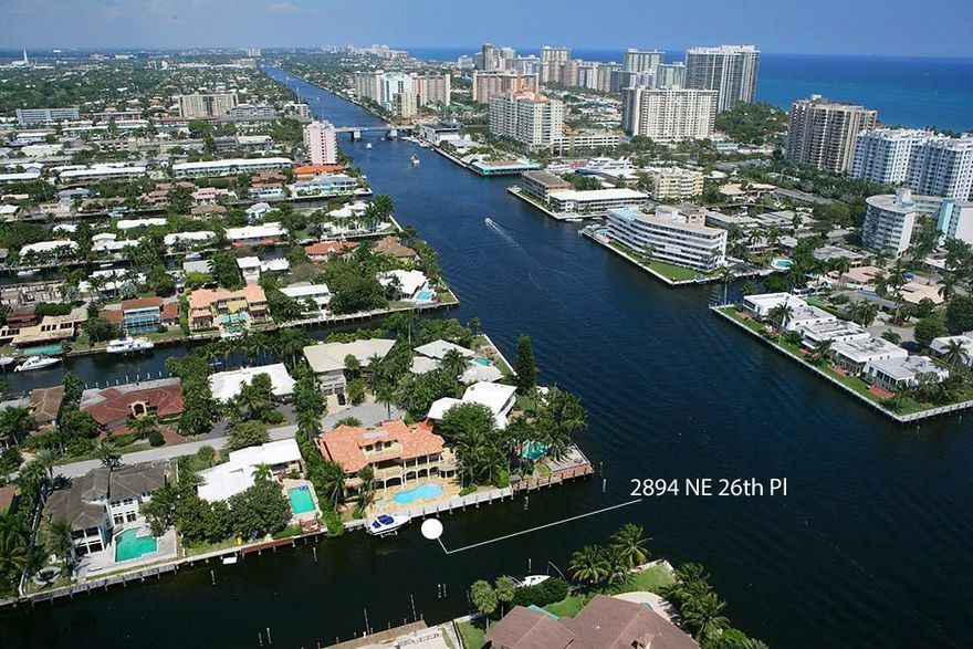 Intracoastal Views. 129 Ft Seawall Accommodates 100+ Ft Yacht on Wide Canal. Impact Glass. Camera Security. 20,000 pound Boat Lift. Jerusalem Stone & Cherry Wood Floors. Great Room: 23 Ft Pecky Cypress Ceilings, Two-Story Fireplace & Wet Bar.  Upper-Level Terrace Stretches Entire Length. Summer Kitchen with Wet Bar. 3rd Floor: Wet Bar & Bonus Room. Master BR: Hardwood Floors, Two Walk-In Closets & Juice Bar. Master Bath: Two Water Closets, Bidet, Spa Tub & Separate Glass Shower. Kitchen: Tin Ceiling, Large Island, Gas Cooking. Game Table Room: Coffered Ceiling & Wet Bar. Four Bedroom Suites Upper Level & 5th Bedroom Suite or Office on Ground Level. Oversized Three Bay Garage with additional Auto Lift for Sportscars. It can be Purchased with all Furnishings. Original Price: $4.295 Million.