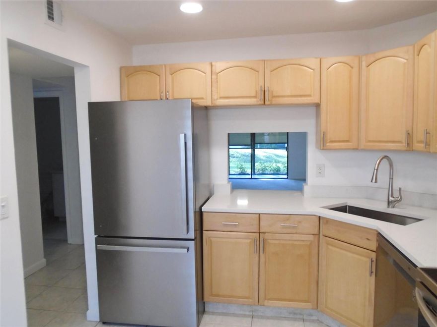 Move in ready first floor 2 bedroom 2 full bath, all ages condo with an IN UNIT washer and dryer. Features include an updated kitchen with quartz counter tops and newer stainless steel appliances, good size bedrooms, an inviting screened porch with yard space, plus fresh paint throughout. Conveniently located close to Federal Highway's restaurants and shopping plus just a short drive to the beach. See it today!