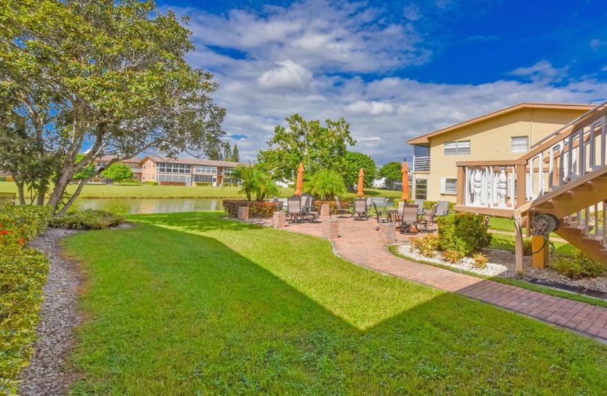 Step into this beautifully bright and spacious first-floor corner unit in the highly desired 55+ Century Village community. Enjoy an open-concept layout with gleaming large-format neutral tile floors throughout, creating a clean and modern feel. The living area offers a peaceful water view, perfect for relaxing mornings or quiet evenings. Both bathrooms have been tastefully updated, adding comfort and style.

Located in the convenient Bedford section, just a short walk to the main clubhouse and the Haverhill gate, this unit offers both privacy and accessibility. Residents can unwind on the lovely waterside patio, exclusive to Bedford K. Century Village provides the ultimate resort-style livingfeaturing a grand clubhouse with a theater, fitness center, indoor and outdoor pools, shuffleboard, pickleball, tennis, and countless social clubs. With 24-hour gated security, roving patrols, and complimentary transportation, you'll experience a vibrant and carefree lifestyle every day.