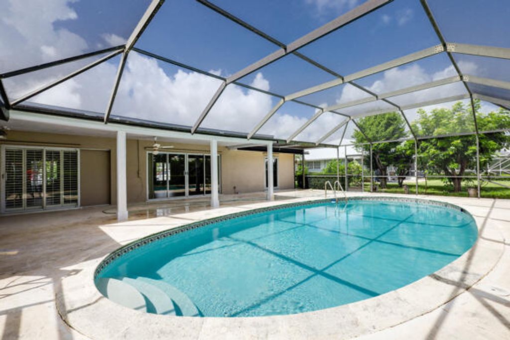 Photo of 220 N Country Club Drive, Atlantis, FL 33462 (MLS # R11005977)