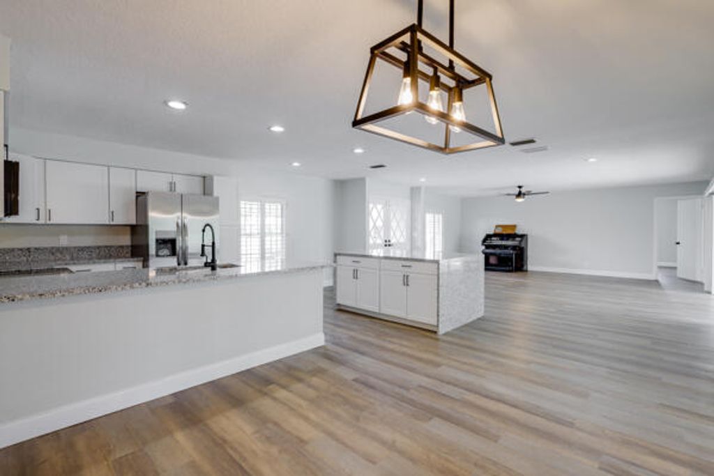 Photo of 220 N Country Club Drive, Atlantis, FL 33462 (MLS # R11005977)