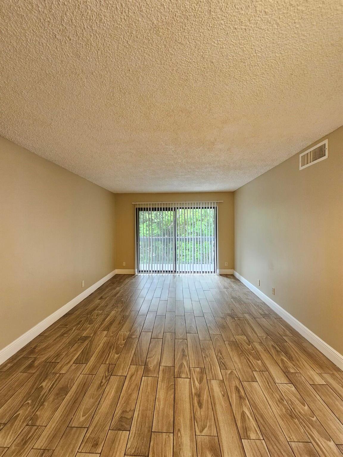Spacious 2-bedroom, 1-bath unit on the 3rd floor, conveniently located next to the laundry room. The building offers an elevator for easy access. Features include wood-look tile flooring throughout, fresh paint, brand-new window blinds, and a brand-new A/C system. Ideally located just minutes from the Turnpike, shopping, dining, and more. Residents enjoy beautifully landscaped grounds, ample guest parking, and peaceful surroundings. Don't miss this great rental opportunity, schedule your showing today!