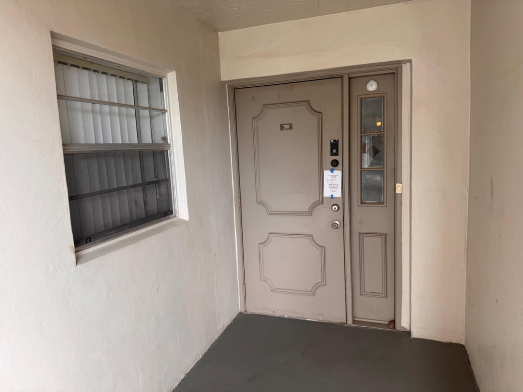 Photo of 9480 Poinciana Place #310, Davie, FL 33324 (MLS # B26061275)