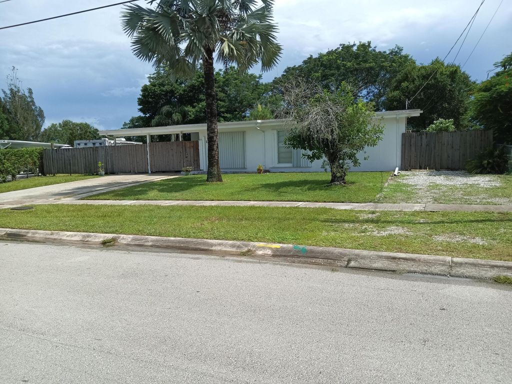 Photo of 100 SE Naranja Avenue, Port Saint Lucie, FL 34983 (MLS # R11047109)