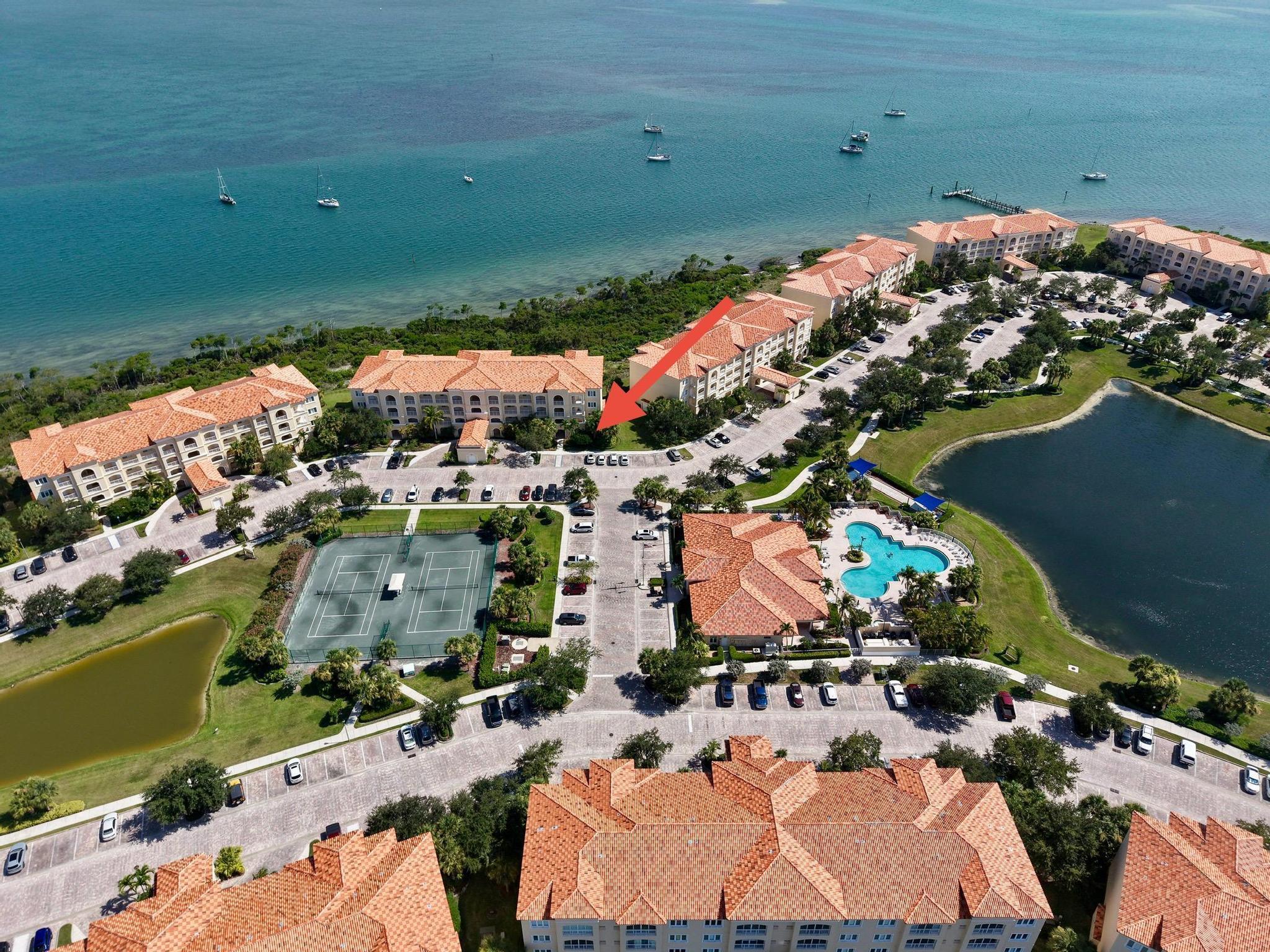 Island living at it's best. You'll love this bottom floor, end unit with a beautiful view of the Indian River. These condo's are popular for location and they're very spacious with a lot of closet & storage space. Nicely updated, with crown molding through out, plantation shutters, new fans, barn door for privacy to second bedroom and bath. The kitchen has newer SS Appliances and a double oven. The flex space has been nicely updated with a room for guests or quiet space with custom shelving, new tile floor, new washer and dryer (2021). The AC is 2024, Water Heater 2024. Located steps from the pool and tennis courts. There are many amenities in this community. You are literally minutes from the causeway, many restaurants, the beach, the Jetty and downtown Ft Pierce.