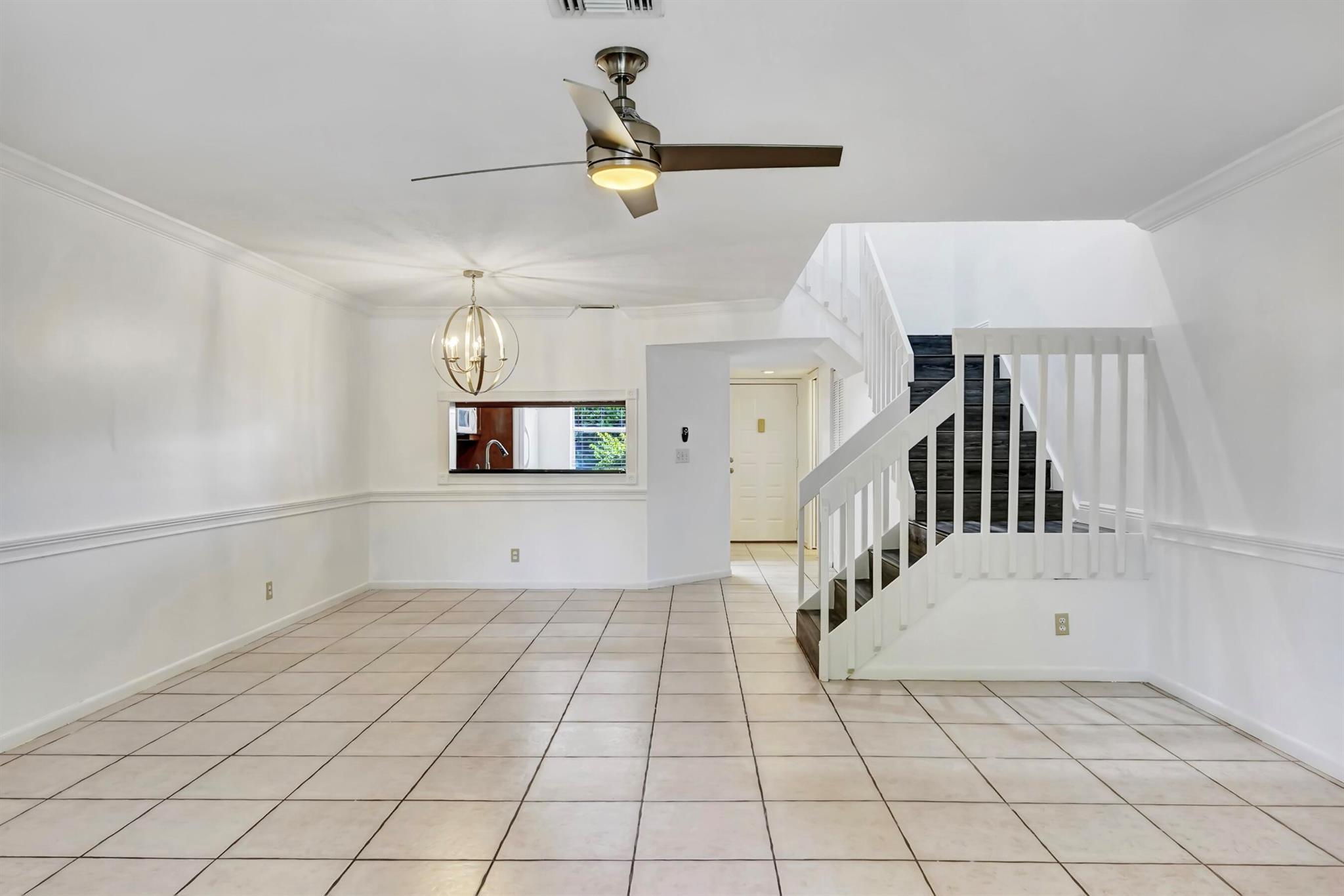 Discover this lakefront condo in central Boca, ideally located near the beach, Town Center Mall, Mizner Park, FAU, shopping, dining, I-95, and the Turnpike. Zoned for A+ schools, this home offers a bright open floor plan with freshly painted walls, new flooring and updated blinds. The kitchen features ample cabinetry, a large pantry, and room for a breakfast nook, with a convenient half bath and tons of storage downstairs. Upstairs, enjoy two primary suites, each with an en-suite bath, walk-in closet, and new plank flooring, plus a washer and dryer. Step outside to your private patio with serene lake views - perfect for relaxing or entertaining. Accordion shutters provide storm protection, and you're just steps from the community pool and spa, making it easy to enjoy the Florida lifestyle