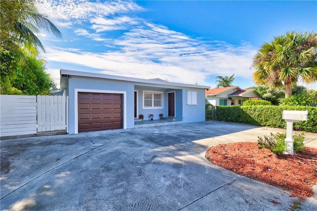 Photo of 1389 W 33rd Street, Riviera Beach, FL 33404 (MLS # F10545537)