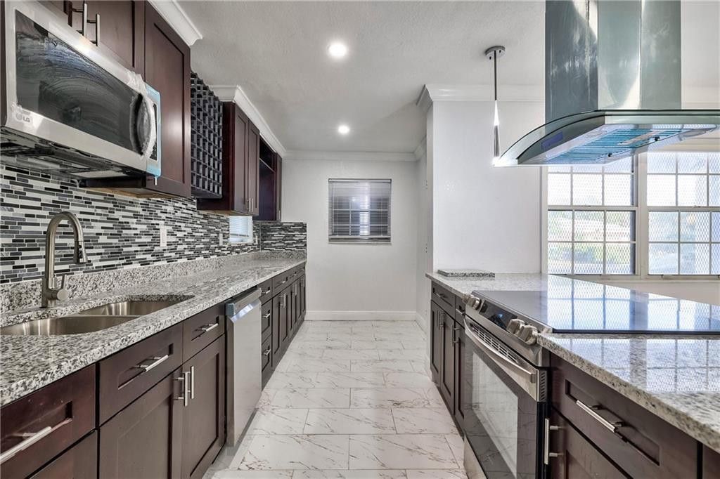 Photo of 1389 W 33rd Street, Riviera Beach, FL 33404 (MLS # F10545537)
