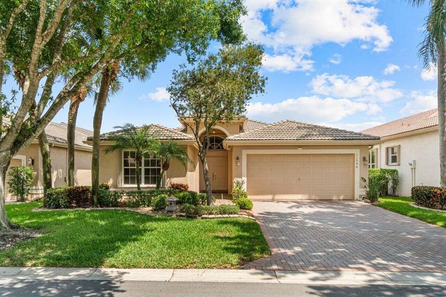 Beautiful Coral model with wall down offers an open floor plan with 2 bedrooms + den, 2 baths, and an extended patio overlooking a serene lakeview. Upgrades include: neutral tile on a diagonal throughout main living area, recessed lighting, granite kitchen counters, custom closet systems in master suite, complete accordion shutters, newer AC and more! Valencia Lakes is an active 55+ community with tons of amenities including a Café.